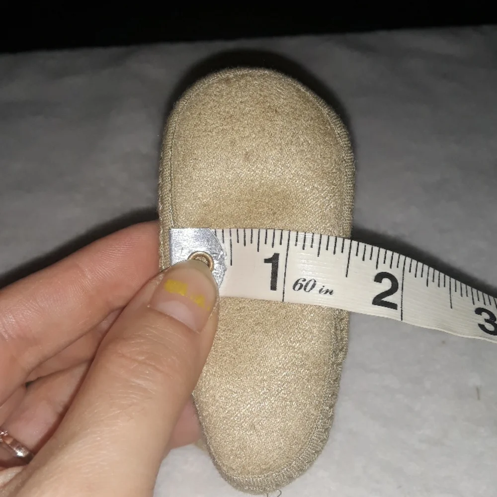 Newborn Tan soft baby boots with warm inner layer.